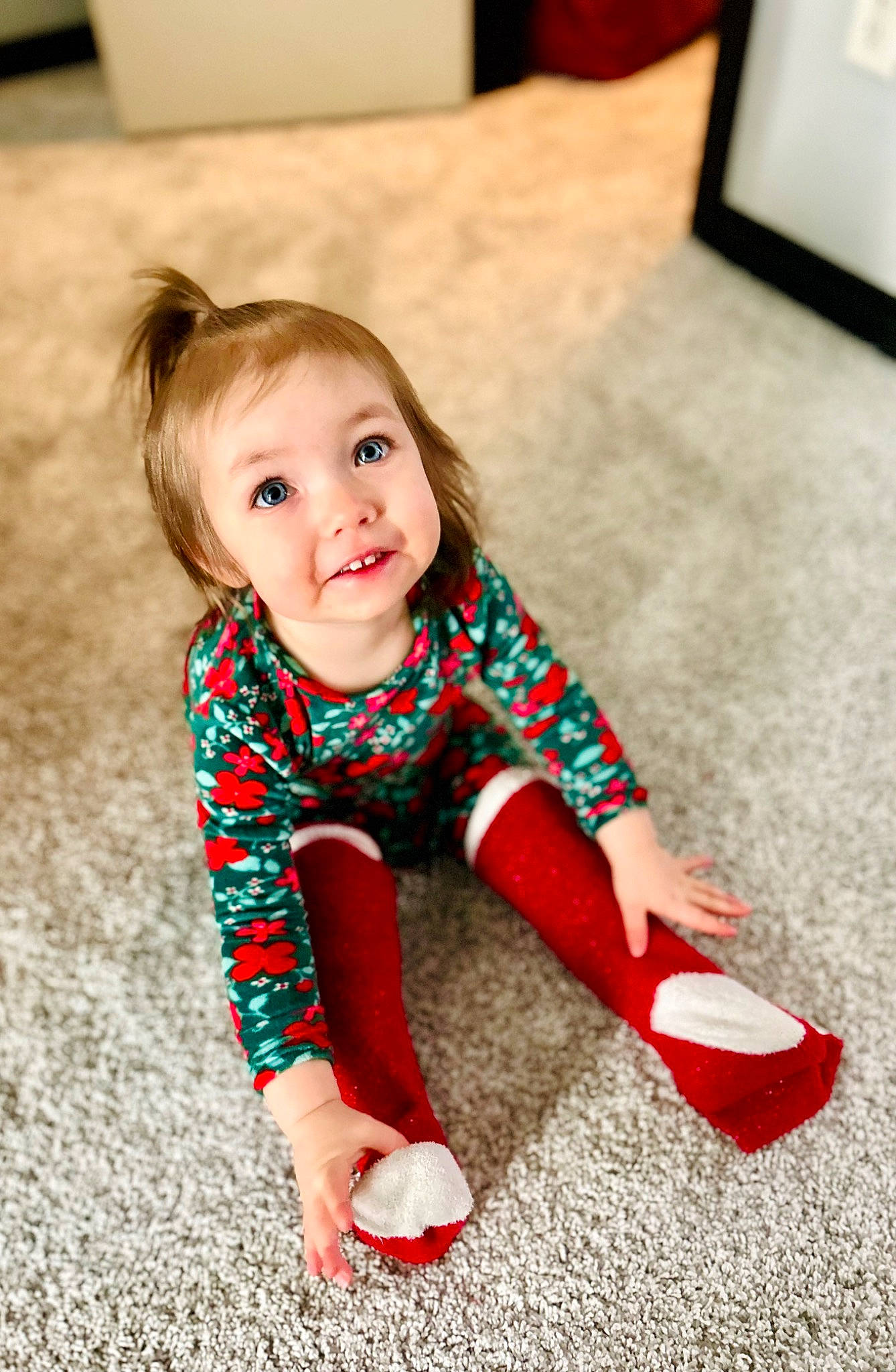Aubriel is registered to the contest to win money with this photo: baby, baby_toddler_clothing, comfort, eye, face, facial_expression, floor, flooring, hair, happy, head, human_leg, knee, pattern, person, skin, sleeve, smile, sock, toddler