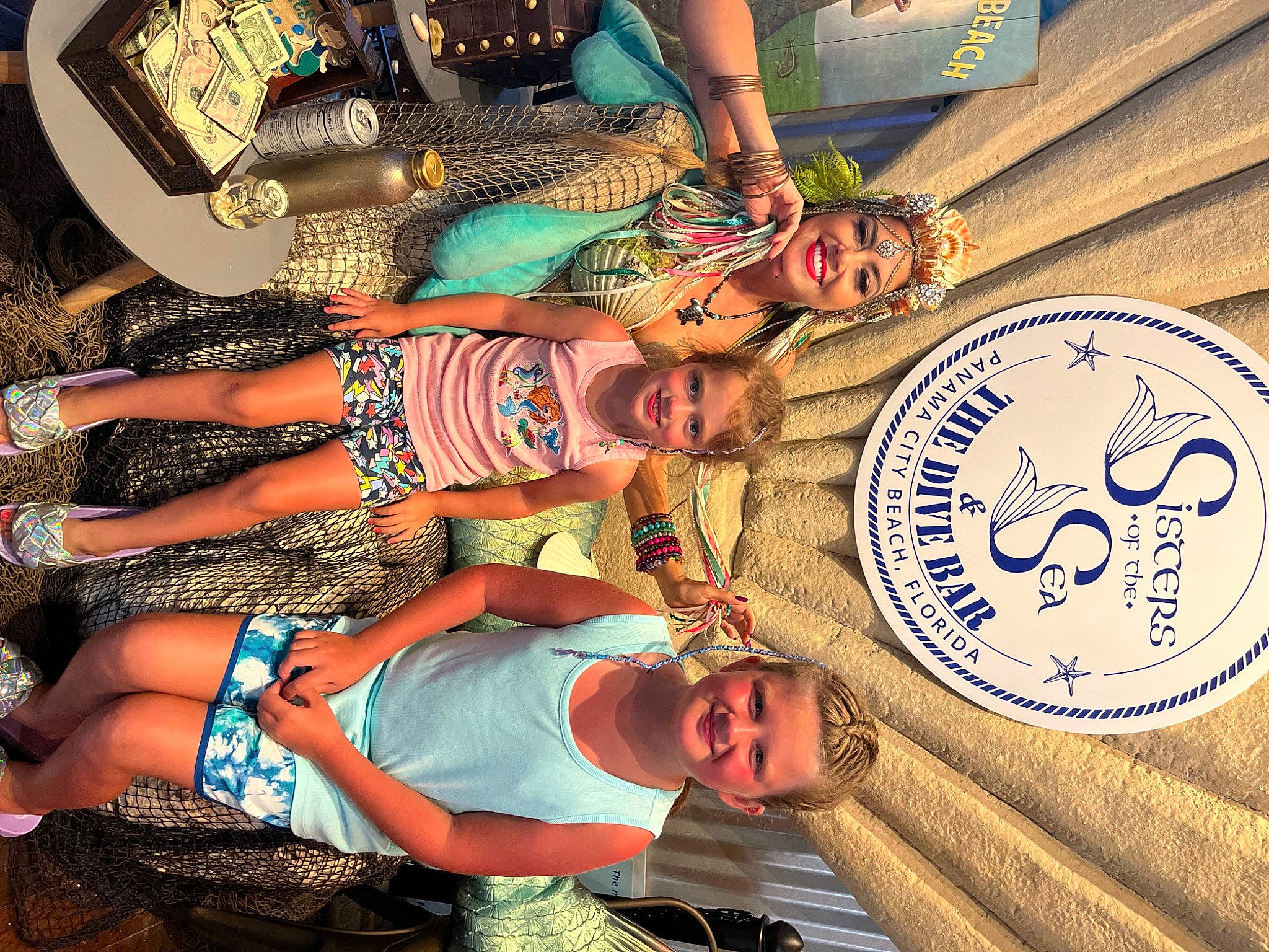 Kiley is registered to the contest to win money with this photo: arm, art, circle, cool, event, fun, green, hand, happy, hat, headwear, human_leg, joy, leisure, organ, pattern, person, t_shirt, textile, thigh