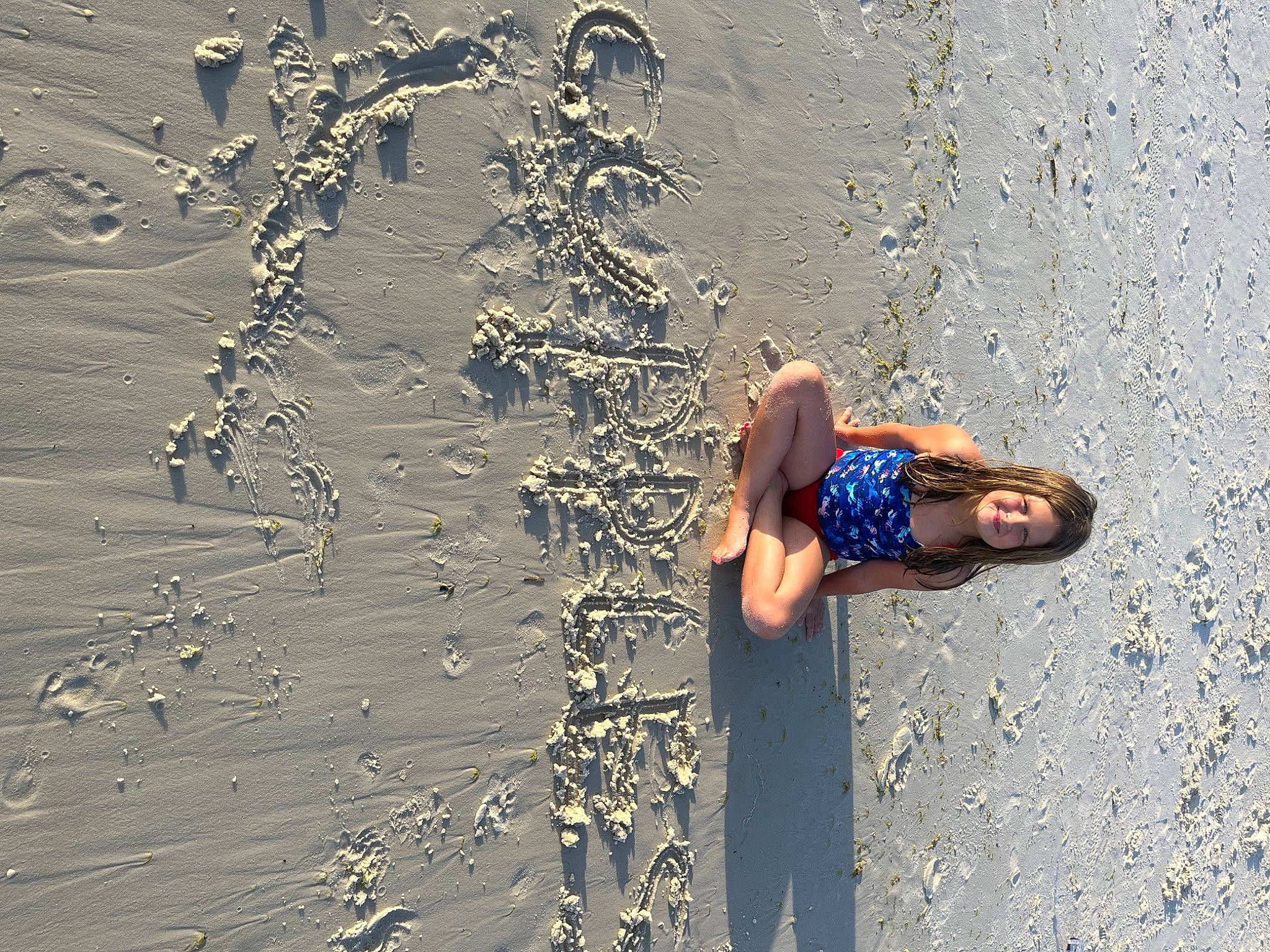 Kiley joined the competition — help win amazing prizes! asphalt, beach, body_of_water, electric_blue, fun, happy, human_leg, joy, landscape, leisure, morning, people_in_nature, person, recreation, reflection, road_surface, sand, shadow, wall, water