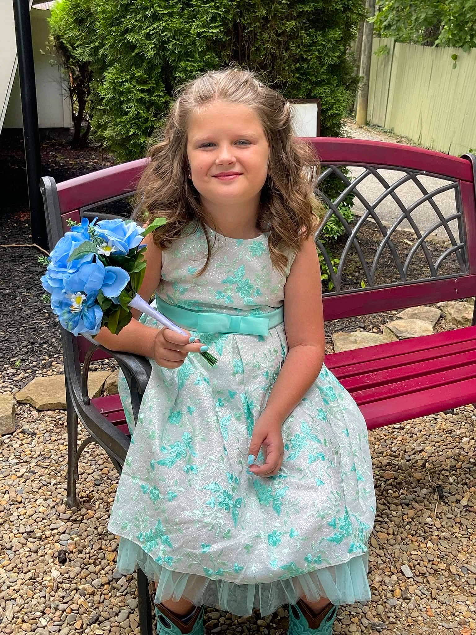 Kiley is registered to the contest to win money with this photo: botany, child, day_dress, dress, event, flower, formal_wear, fun, grass, hairstyle, happy, iris, joy, leaf, leisure, person, pink, plant, smile, summer