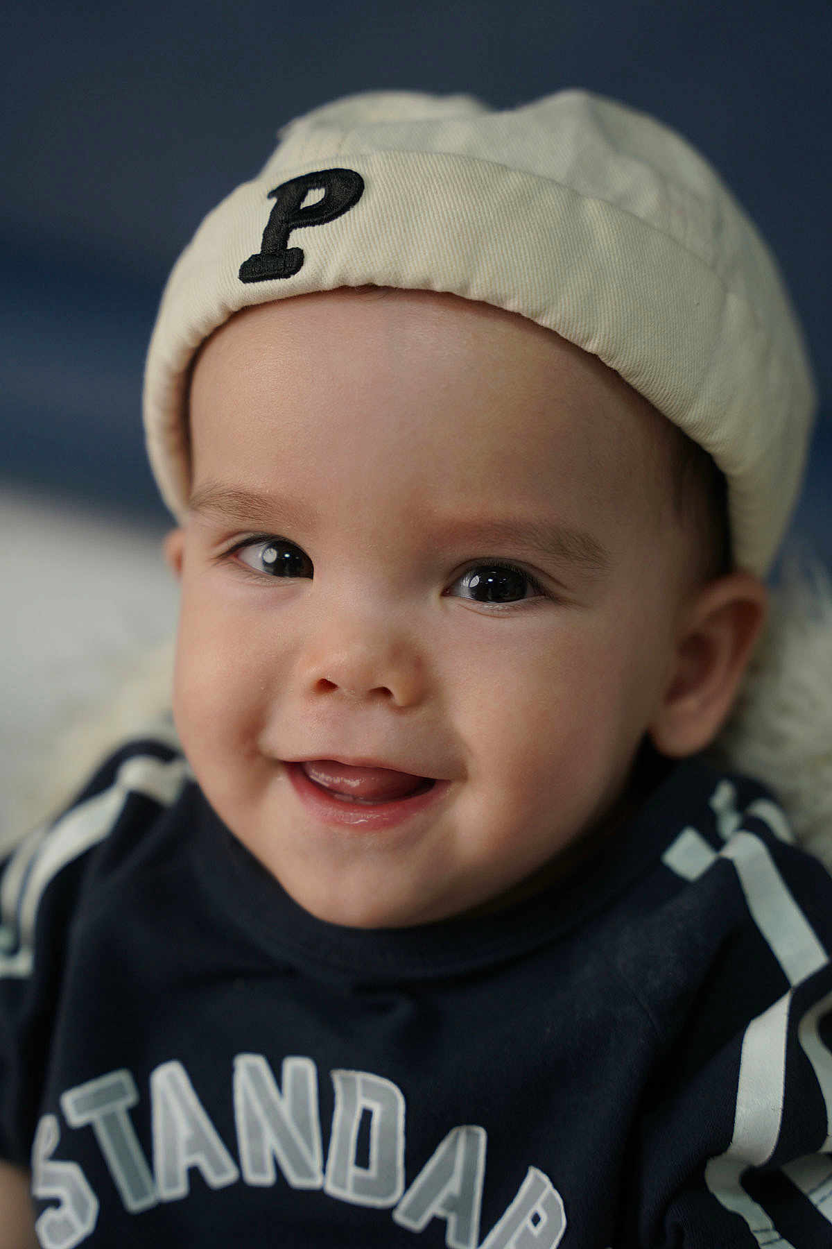 Kayden joined the competition — help win amazing prizes! baby, child, smiling, hat, clothing, face, portrait, cute, happy, infant, person, apparel, headwear, young, closeup, eyes, tongue, sitting, indoors, fashion