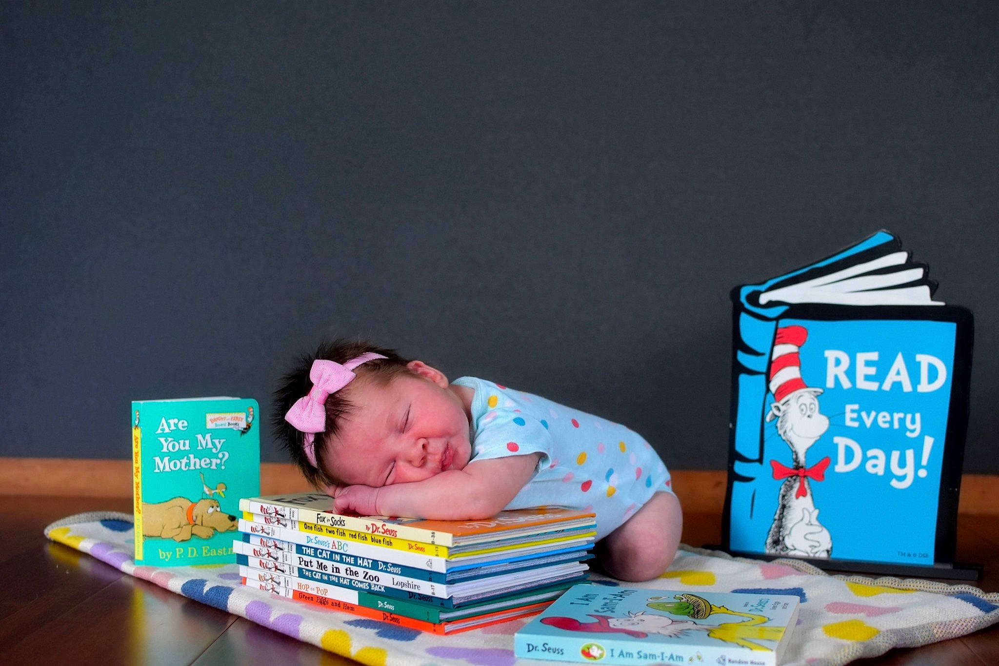 Kaitlynn joined the competition — help win amazing prizes! baby, bedtime, book, child, desk, eyewear, font, paper, paper_product, person, publication, reading, room, sitting, table, toddler