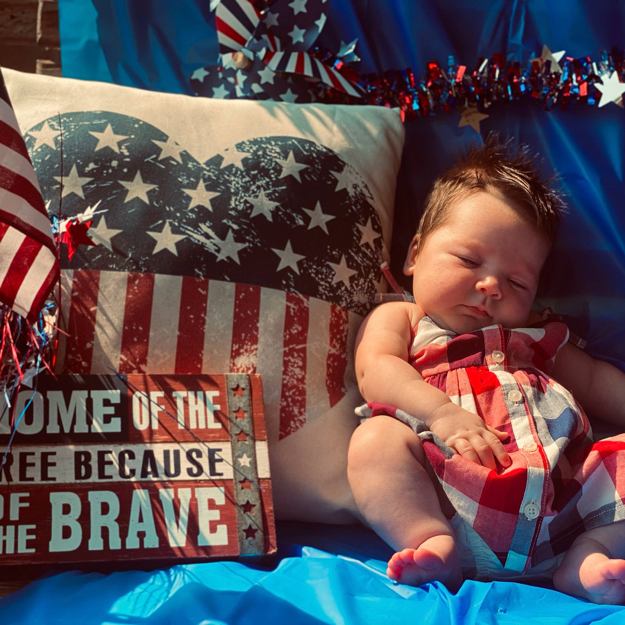 Kaitlynn is registered to the contest to win money with this photo: baby, baby_toddler_clothing, beauty, blue, cloud, cool, couch, flag_of_the_united_states, font, happy, human, lap, morning, person, photograph, product, sky, summer, t_shirt, toddler