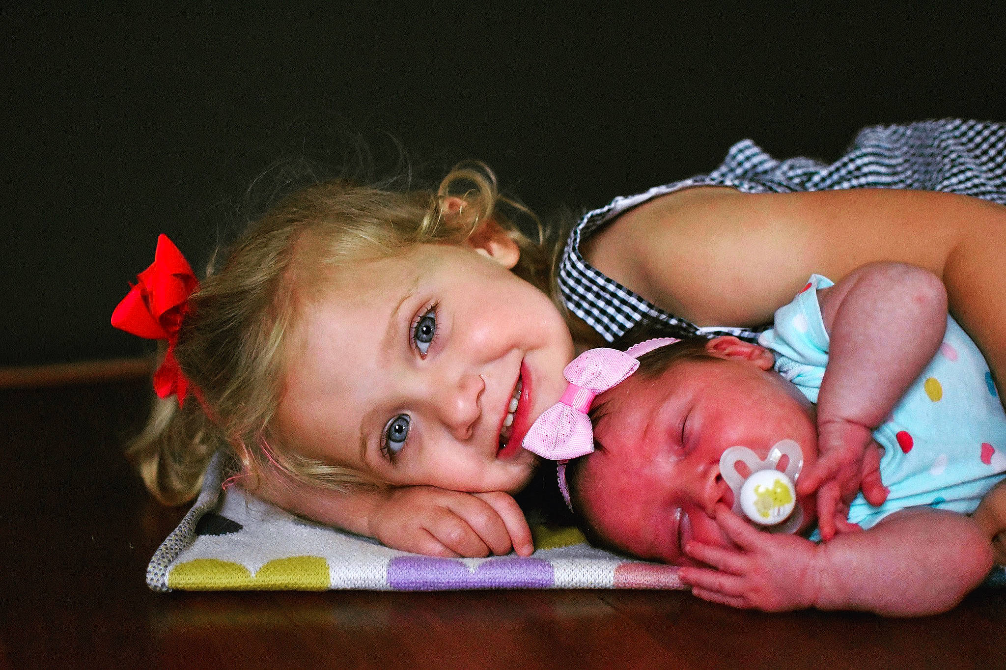 Emileigh is registered to the contest to win money with this photo: baby, baby_products, baby_toddler_clothing, cheek, child, dress, facial_expression, flash_photography, fun, happy, human_body, iris, jewellery, joy, lip, mouth, nose, person, sitting, skin