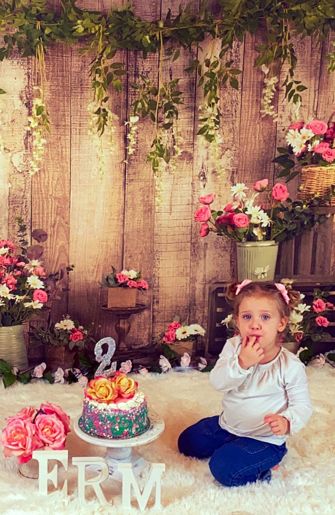 Emileigh is registered to the contest to win money with this photo: baby_toddler_clothing, baked_goods, birthday_cake, cake, cake_decorating, cake_decorating_supply, event, flower, flower_arranging, flowerpot, food, icing, orange, person, petal, photograph, pink, plant, sugar_cake, textile