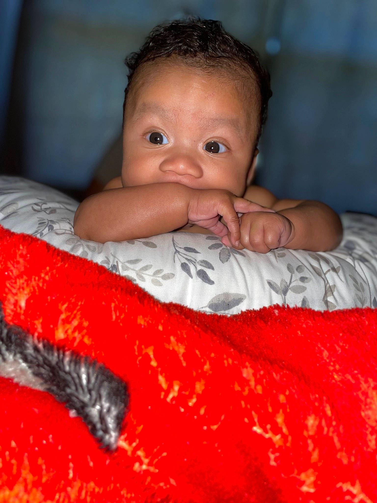 Messiah is registered to the contest to win money with this photo: baby, baby_toddler_clothing, bedding, bedtime, carmine, cheek, child, comfort, eye, eyelash, flash_photography, flesh, iris, linens, nose, pattern, person, room, sleeve, textile