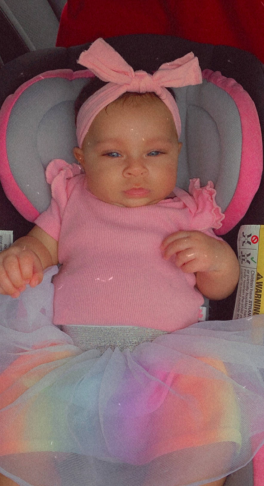 Azariea is registered to the contest to win money with this photo: baby, baby_products, baby_toddler_clothing, cheek, chin, comfort, fun, hairstyle, human_body, iris, lip, mouth, nose, person, pink, sitting, skin, sleeve, textile, thumb