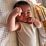 Salim joined the competition — help win amazing prizes! arm, baby, bed, blanket, child, cozy, cute, expression, face, fist, hand, indoors, infant, person, pillow, portrait, resting, skin, sleepwear, tank_top