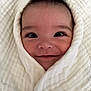 Salim joined the competition — help win amazing prizes! baby, smiling, face, blanket, wrapped, infant, closeup, cute, happy, child, soft, texture, portrait, head, eyes, skin, warm, cozy, newborn, person