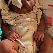 Olivia . is registered to the contest to win money with this photo: baby, sleeping, infant, bow, onesie, blanket, cute, peaceful, child, newborn, fingers, toes, patterned_clothing, soft, resting, indoors, portrait, closeup, adorable, cozy