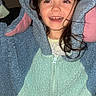 Kalia is registered to the contest to win money with this photo: blue, child, clothing, costume, cute, face, fleece, fun, hair, happy, hood, indoor, person, pink, playful, portrait, smiling, teeth, young, zipper