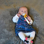 Iris participe au concours pour gagner de l'argent avec cette photo : baby, infant, pacifier, denim_dress, white_tights, slippers, minnie_mouse, blanket, textured, cute, child, lying_down, indoors, clothing, person, small, face, head, hands, feet