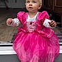 Lucy participe au concours pour gagner de l'argent avec cette photo : child, toddler, dress, pink, princess, blue_eyes, sitting, indoors, doorstep, curious, cute, costume, white_socks, floor, portrait, person, young_child, fashion, celebration, home