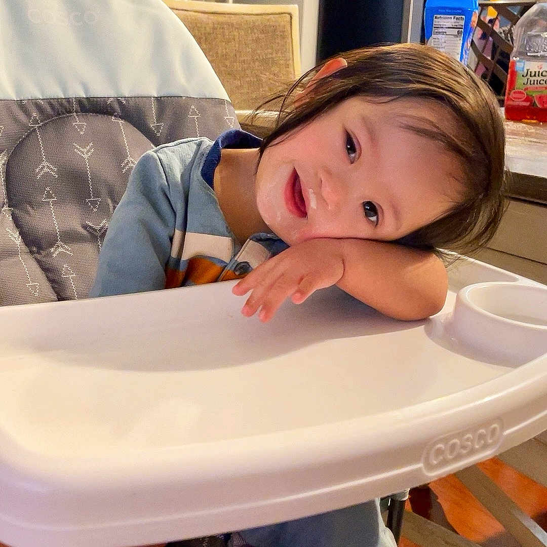 Elohn is registered to the contest to win money with this photo: architecture, art, baby, building, chair, clothing, desk, diningroom, diningtable, face, furniture, hat, head, highchair, indoors, painting, person, photography, portrait, table