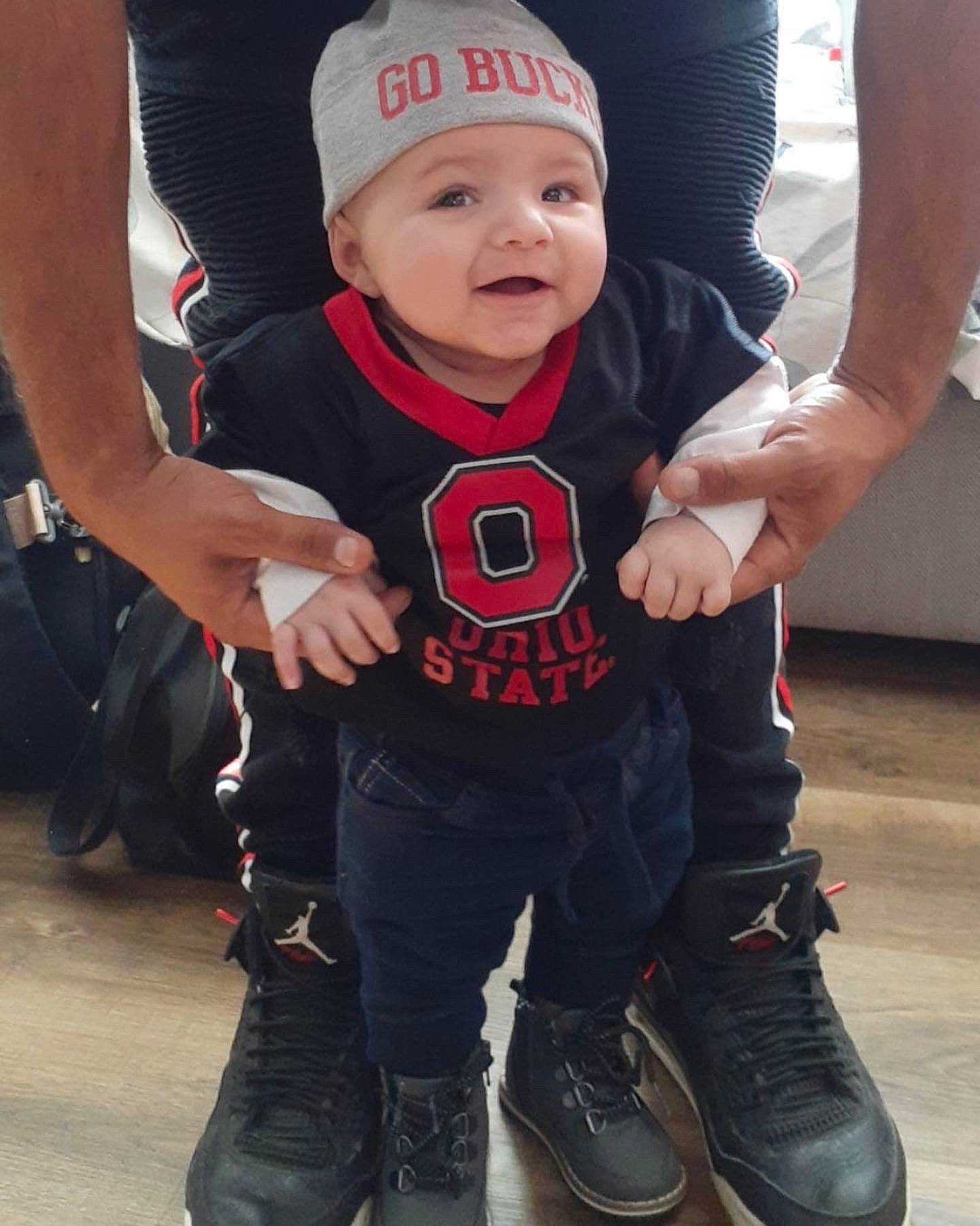 Laken joined the competition — help win amazing prizes! baby, baseball_cap, cap, carmine, cool, electric_blue, fun, gesture, headwear, human_leg, joint, knee, leg, person, personal_protective_equipment, recreation, sleeve, smile, sneakers, t_shirt