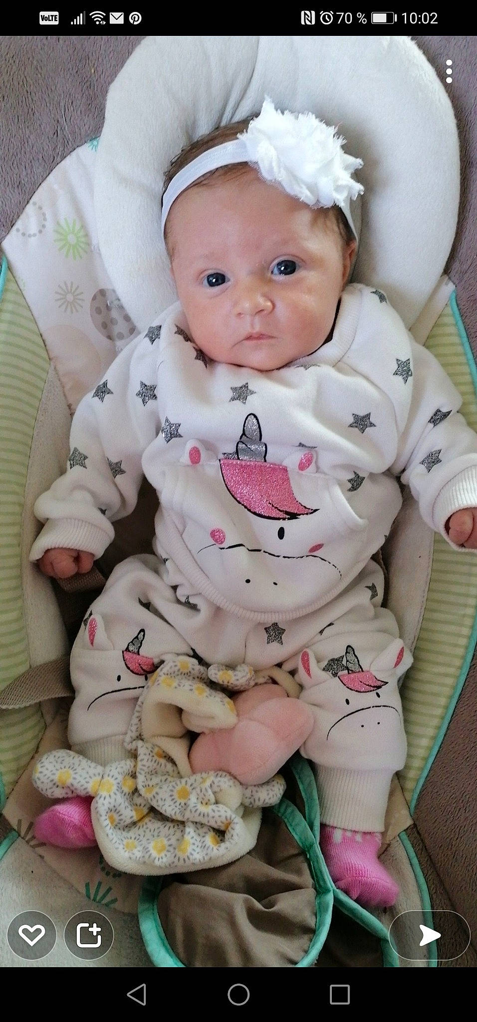 Lola participe au concours pour gagner de l'argent avec cette photo : baby, baby_products, baby_safety, baby_toddler_clothing, carmine, cheek, child, collar, comfort, eye, happy, linens, lip, pattern, person, pink, sitting, skin, sleeve, toddler