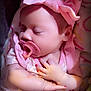 adorable, baby, blanket, child, closeup, clothing, cozy, cute, headband, indoors, infant, nail_polish, newborn, pacifier, peaceful, pink_bow, portrait, resting, sleeping, soft_lighting