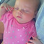 Kashlynn is registered to the contest to win money with this photo: baby, sleeping, pink_onesie, nail_polish, hand, foot, tattoo, person, closeup, cute, infant, resting, peaceful, skin, fingernails, toenails, clothing, arm, holding, indoor