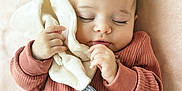 Maylee participe au concours pour gagner de l'argent avec cette photo : baby, sleeping, onesie, clothing, blanket, soft_toy, hand, face, infant, peaceful, cute, closeup, portrait, child, cozy, indoor, toddler, fabric, relaxation, comfort