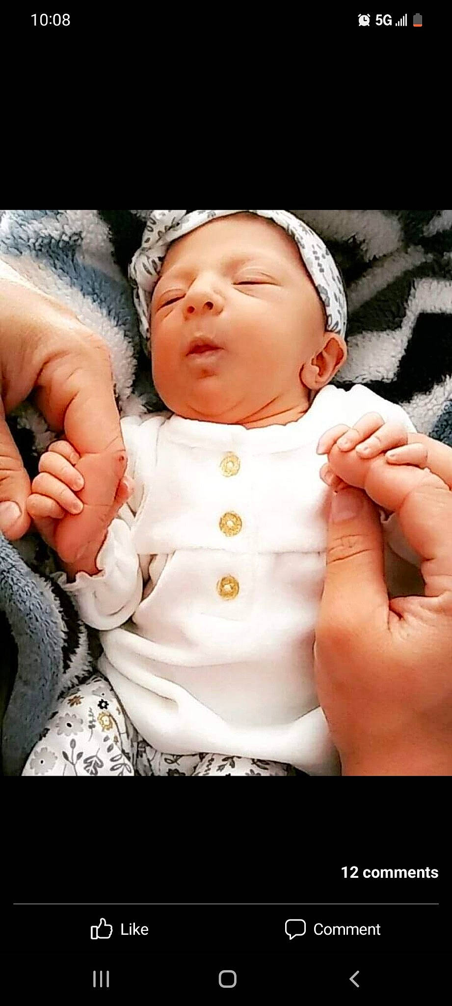 Luna is registered to the contest to win money with this photo: arm, baby, baby_sleeping, baby_toddler_clothing, cheek, child, comfort, finger, gesture, hand, happy, head, human_body, lip, mouth, nose, person, skin, sleeve, thumb