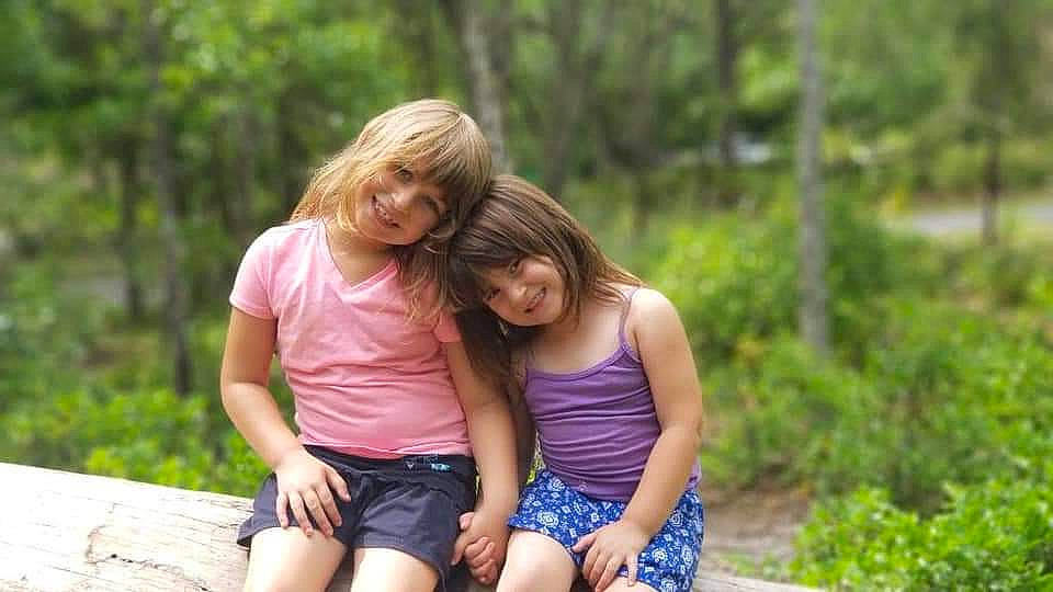 Kendall is registered to the contest to win money with this photo: botany, forest, grass, hair, happy, human, interaction, joy, leaf, leisure, mammal, nature, people_in_nature, person, plant, shorts, shoulder, smile, summer, thigh