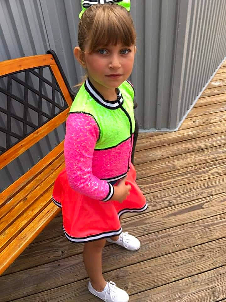 Leyla joined the competition — help win amazing prizes! baby_toddler_clothing, blond, child, flooring, fun, green, happy, hardwood, human_leg, leisure, magenta, pattern, person, pink, sleeve, sportswear, standing, thigh, toddler, waist