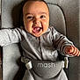 baby, infant, smile, happy, grey_clothing, baby_seat, straps, face, mouth_open, arms_outstretched, indoor, child, cute, joyful, person, one_person, young_child, seat, fabric, closeup
