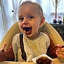 Kaylan participe au concours pour gagner de l'argent avec cette photo : toddler, child, high_chair, chocolate, mousse, messy, bib, happy, smiling, food, dessert, indoor, face, hands, mouth, clothing, table, container, curtain, decor