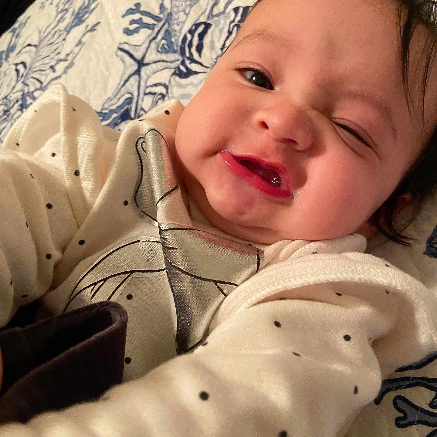 Zozo joined the competition — help win amazing prizes! baby, blanket, blue, child, closeup, cute, expression, face, head, indoor, infant, lying_down, pattern, person, polka_dot, portrait, skin, smiling, white_clothing, young