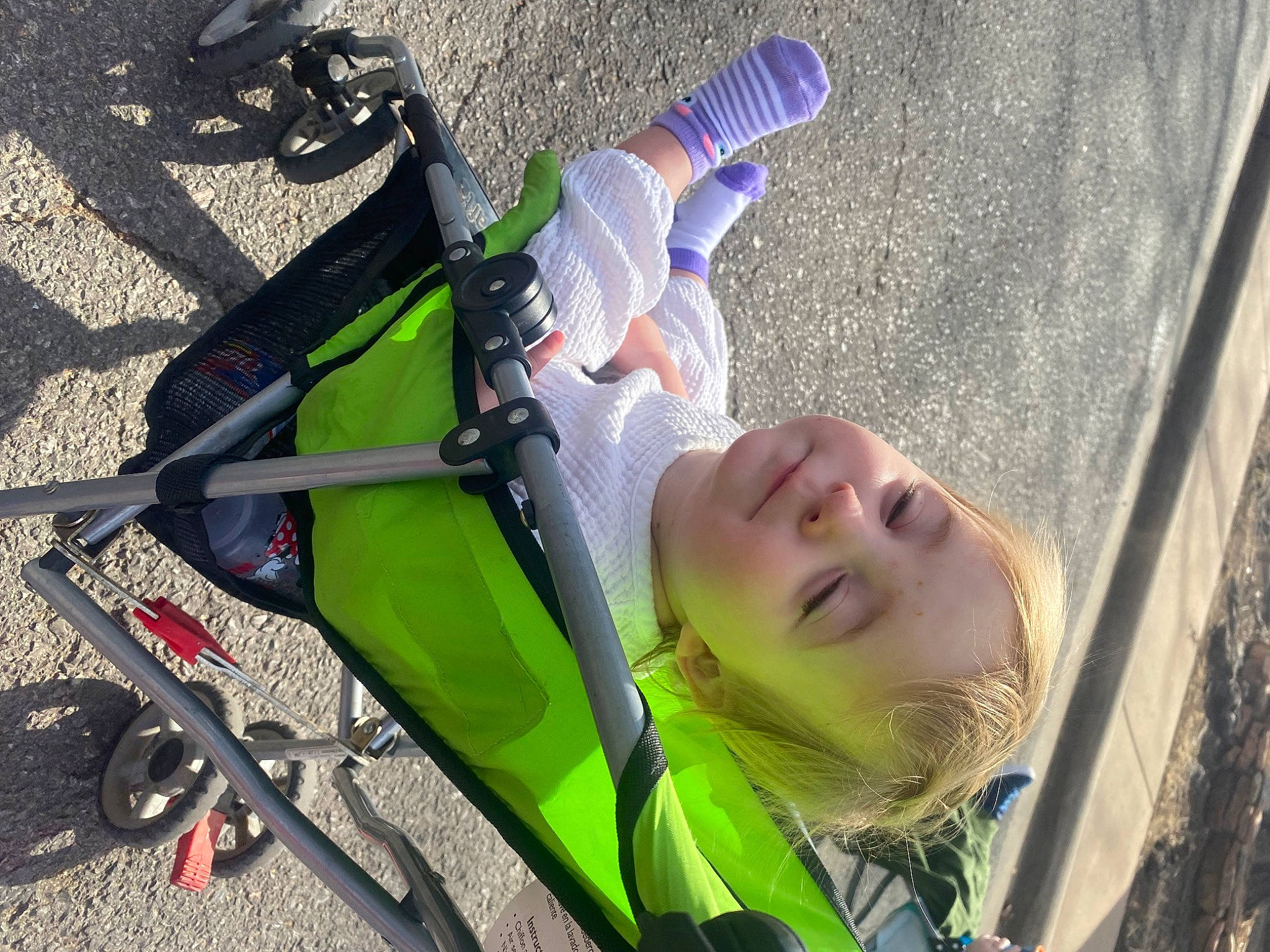 Emmaleigh is registered to the contest to win money with this photo: auto_part, baby, baby_products, child, fun, grass, green, happy, human_leg, leg, leisure, light, person, plant, product, recreation, smile, tire, toddler, tree