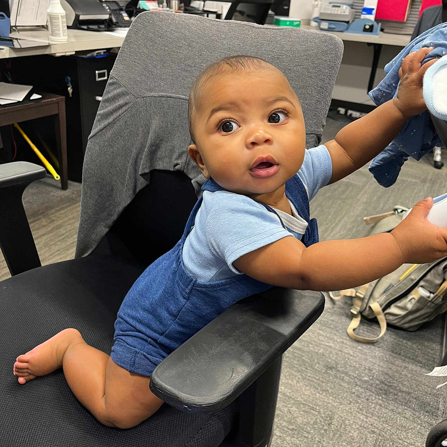 Tristin is registered to the contest to win money with this photo: baby, chair, clothing, computerhardware, desk, electronics, face, footwear, furniture, hardware, head, machine, monitor, person, photography, portrait, screen, shoe, table, wheel