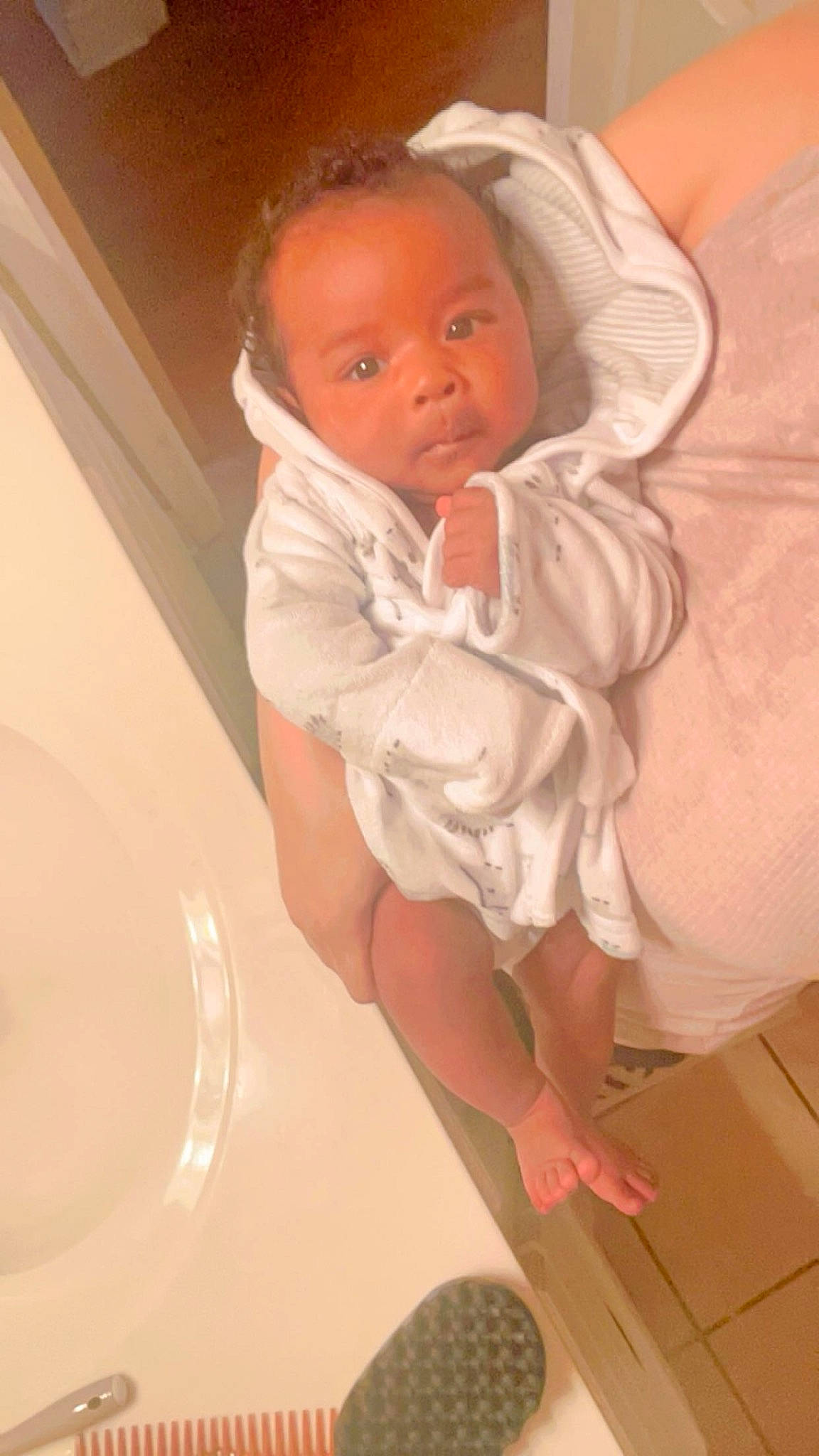 Kyrie joined the competition — help win amazing prizes! automotive_tire, baby, baby_toddler_clothing, bathing, bathroom, cheek, chest, child, comfort, face, floor, flooring, fun, head, human_leg, linens, person, skin, sleeve, thumb