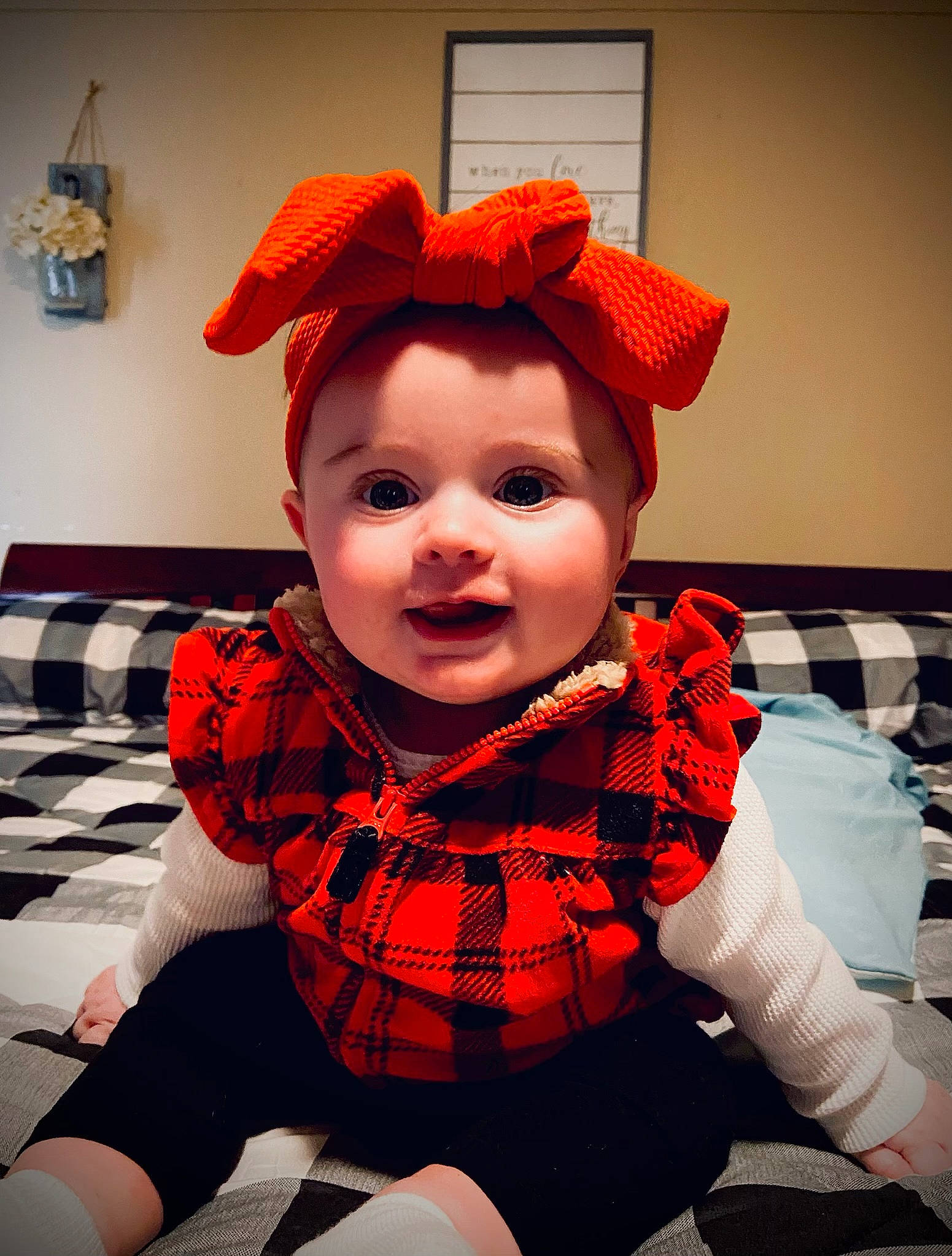 Everleigh is registered to the contest to win money with this photo: baby, baby_toddler_clothing, carmine, collar, comfort, costume_hat, eye, fashion_accessory, flooring, fun, happy, hat, headwear, orange, pattern, person, personal_protective_equipment, plaid, red, sleeve