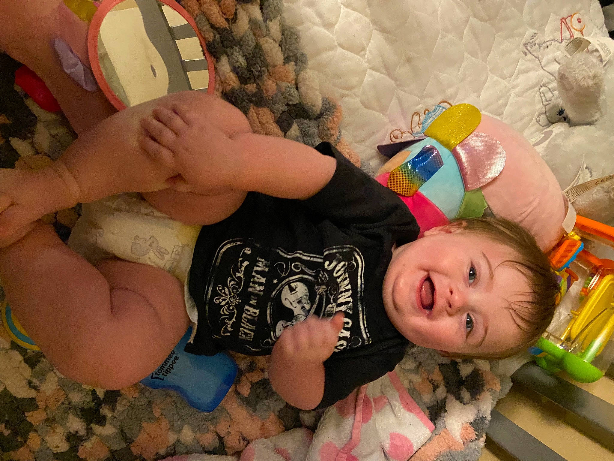 Everleigh is registered to the contest to win money with this photo: blond, chest, child, comfort, elbow, fun, hairstyle, happy, headgear, human_body, human_leg, leg, leisure, mouth, person, skin, smile, textile, thigh, toddler