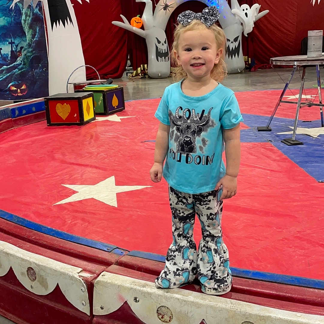 Westlyn joined the competition — help win amazing prizes! ball, child, clothing, costume, face, female, football, girl, hat, head, indoors, outdoors, pants, person, photography, playarea, portrait, shorts, soccer, t_shirt