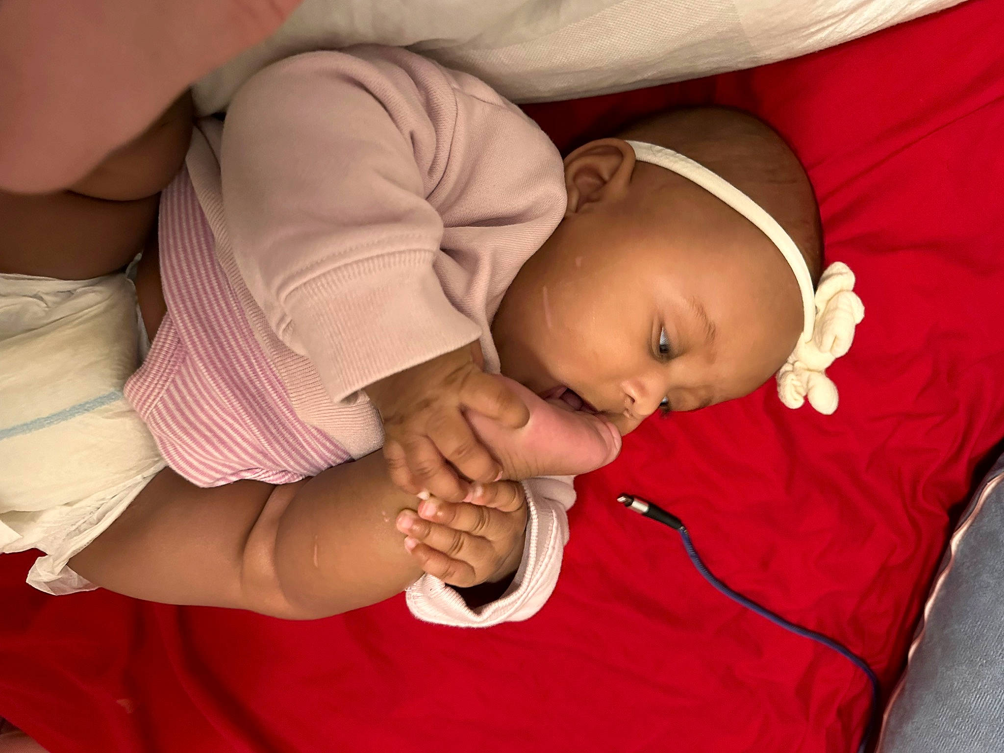 Kyree is registered to the contest to win money with this photo: abdomen, arm, baby, baby_products, baby_sleeping, baby_toddler_clothing, bedtime, child, comfort, elbow, finger, gesture, happy, hat, mouth, nail, person, skin, sleeve, thumb