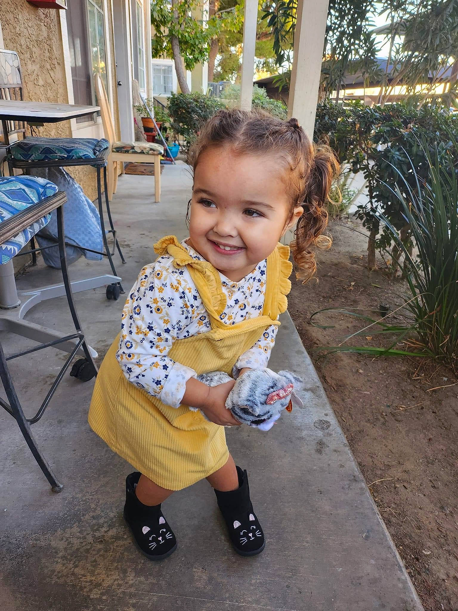 Ava is registered to the contest to win money with this photo: asphalt, baby, baby_toddler_clothing, child, eye, fun, grass, happy, joy, leisure, person, plant, play, public_space, recreation, sandal, sitting, smile, sock, toddler