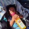 Panthir joined the competition — help win amazing prizes! toddler, child, car_seat, blanket, juice_bottle, orange_juice, sunlight, seatbelt, car_interior, window, blue_blanket, cartoon_characters, drink, baby, clothing, holding, portrait, indoors, seat, person