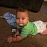 Xain is registered to the contest to win money with this photo: baby, child, infant, portrait, face, eyes, smiling, curious, crawling, sitting, green_shirt, diaper, pacifier, carpet, couch, indoor, home, floor, clothing, photography