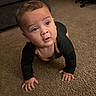 baby, child, infant, crawling, face, eyes, curious, indoor, living_room, carpet, floor, sofa, chair, clothing, black_shirt, hands, portrait, home, photography, adorable
