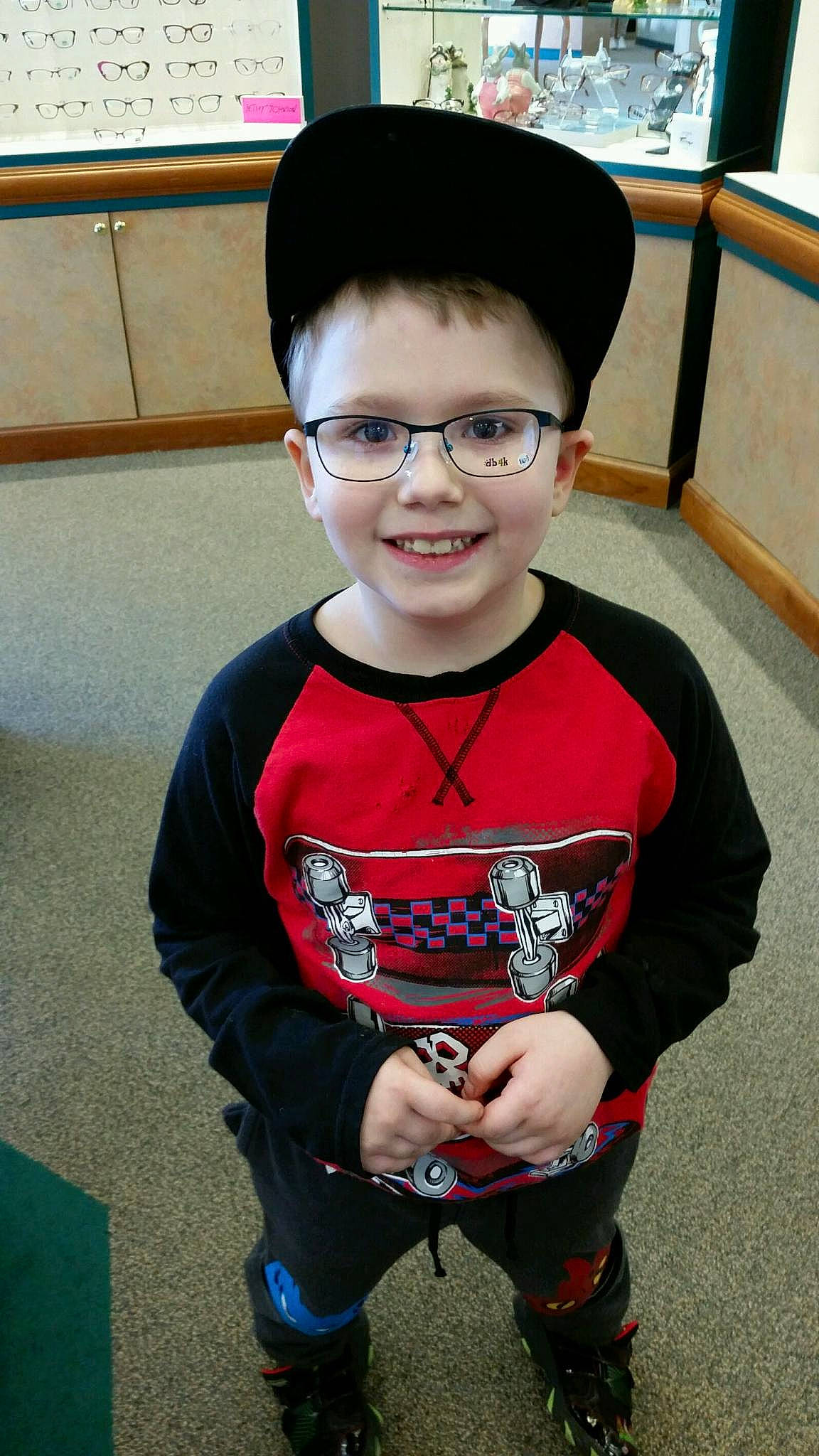 Jasper is registered to the contest to win money with this photo: bowl_cut, child, cool, eyewear, fashion_accessory, glasses, joy, person, smile, t_shirt, toddler