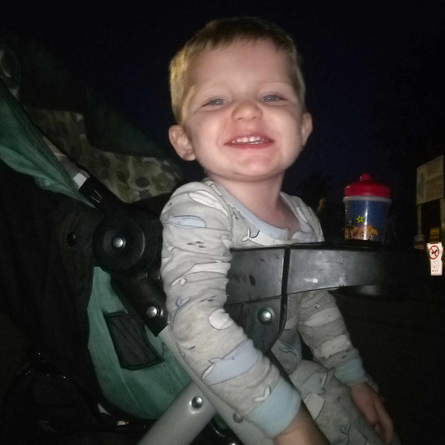 Lucas is registered to the contest to win money with this photo: accessories, baby, bodypart, clothing, coat, face, finger, furniture, hand, happy, head, machine, outdoors, person, photography, portrait, smile, strap, stroller, wheel