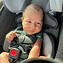 baby, car_seat, child, infant, seatbelt, safety, sunlight, portrait, indoor, young_child, person, clothing, resting, closeup, head, arm, hand, seat, strap, expression