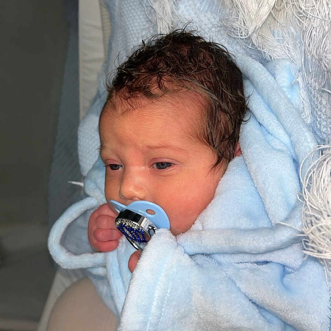 Qays-Khalil is registered to the contest to win money with this photo: baby, blue_blanket, child, closeup, cozy, cute, face, hand, head, indoor, infant, newborn, newborn_baby, pacifier, person, resting, sleepy, soft_texture, warm, wrapped