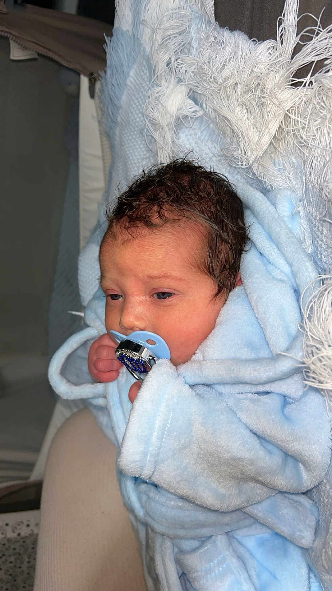 Qays-Khalil is registered to the contest to win money with this photo: newborn, baby, pacifier, blue_blanket, wrapped, soft_texture, indoor, cute, infant, sleepy, hand, face, head, person, resting, cozy, warm, closeup, child, newborn_baby
