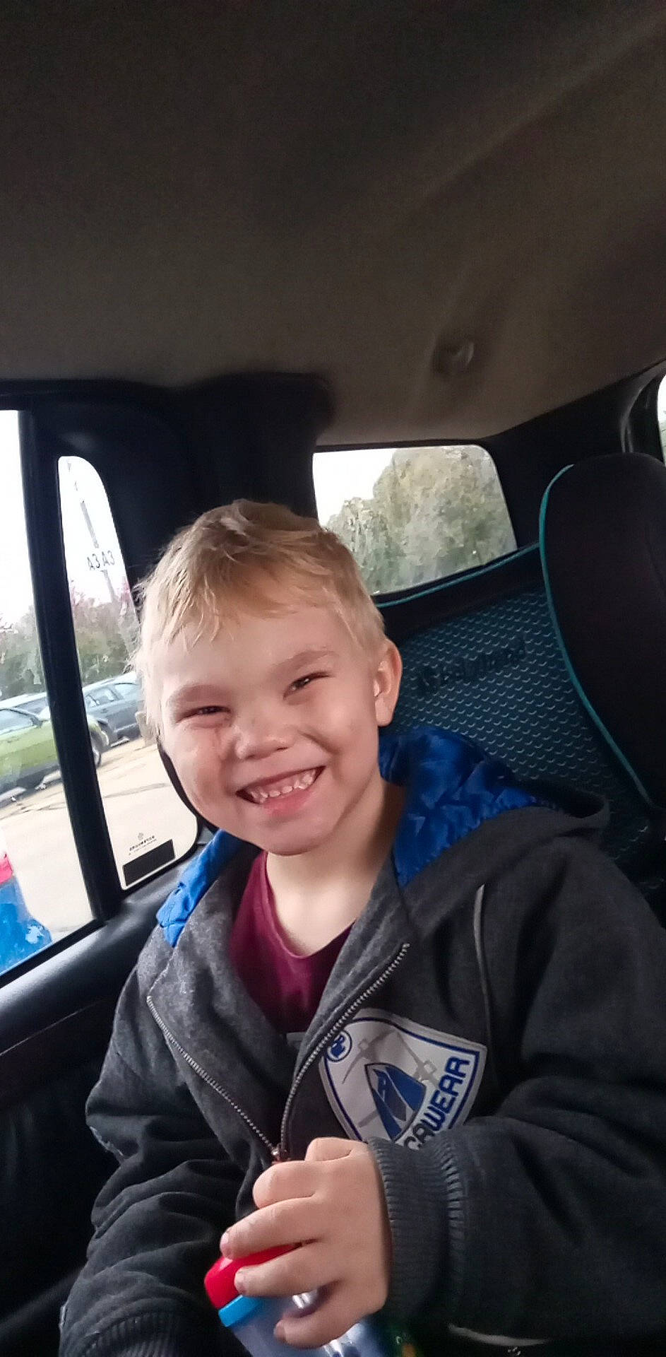 Logan joined the competition — help win amazing prizes! auto_part, automotive_design, automotive_exterior, car, car_seat, car_seat_cover, child, electric_blue, happy, head_restraint, joy, motor_vehicle, person, personal_luxury_car, seat_belt, smile, steering_part, steering_wheel, toddler, vehicle