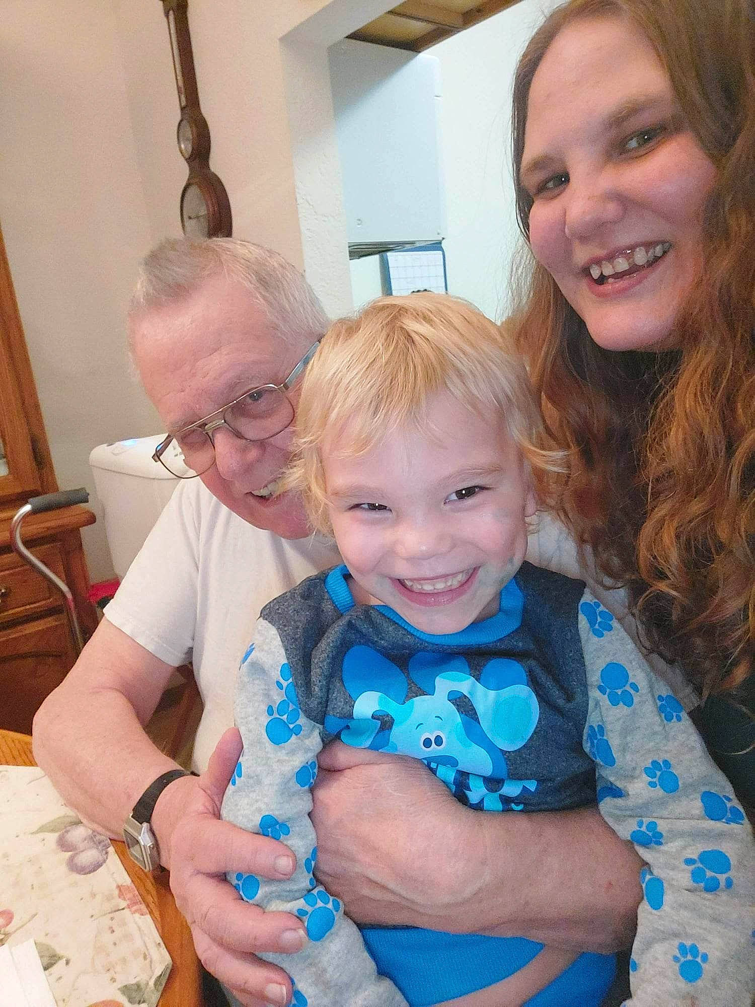 Logan is registered to the contest to win money with this photo: blue, cabinetry, chair, child, electric_blue, event, eye, fun, happy, interaction, iris, joy, necklace, organ, people, person, photograph, shoulder, smile, snapshot