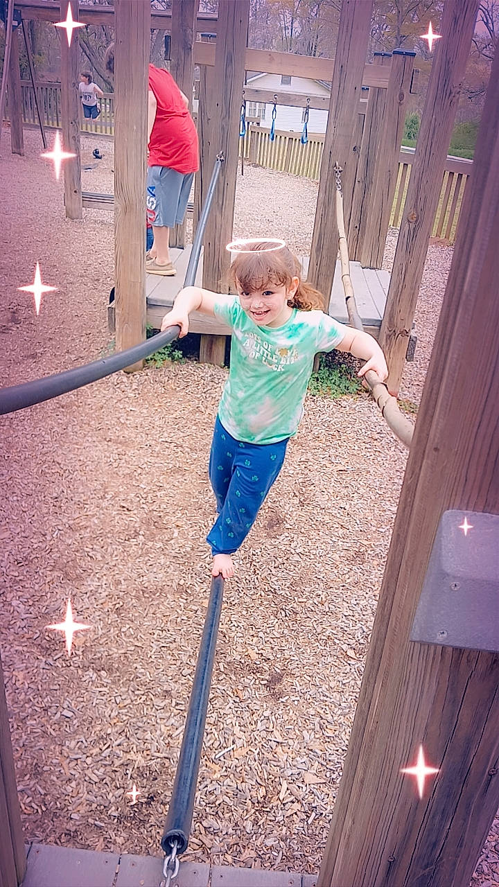 Taylor is registered to the contest to win money with this photo: balance, beauty, city, denim, electric_blue, fun, grass, happy, joy, leisure, light, metal, outdoor_play_equipment, people_in_nature, person, play, recreation, shorts, soil, swing