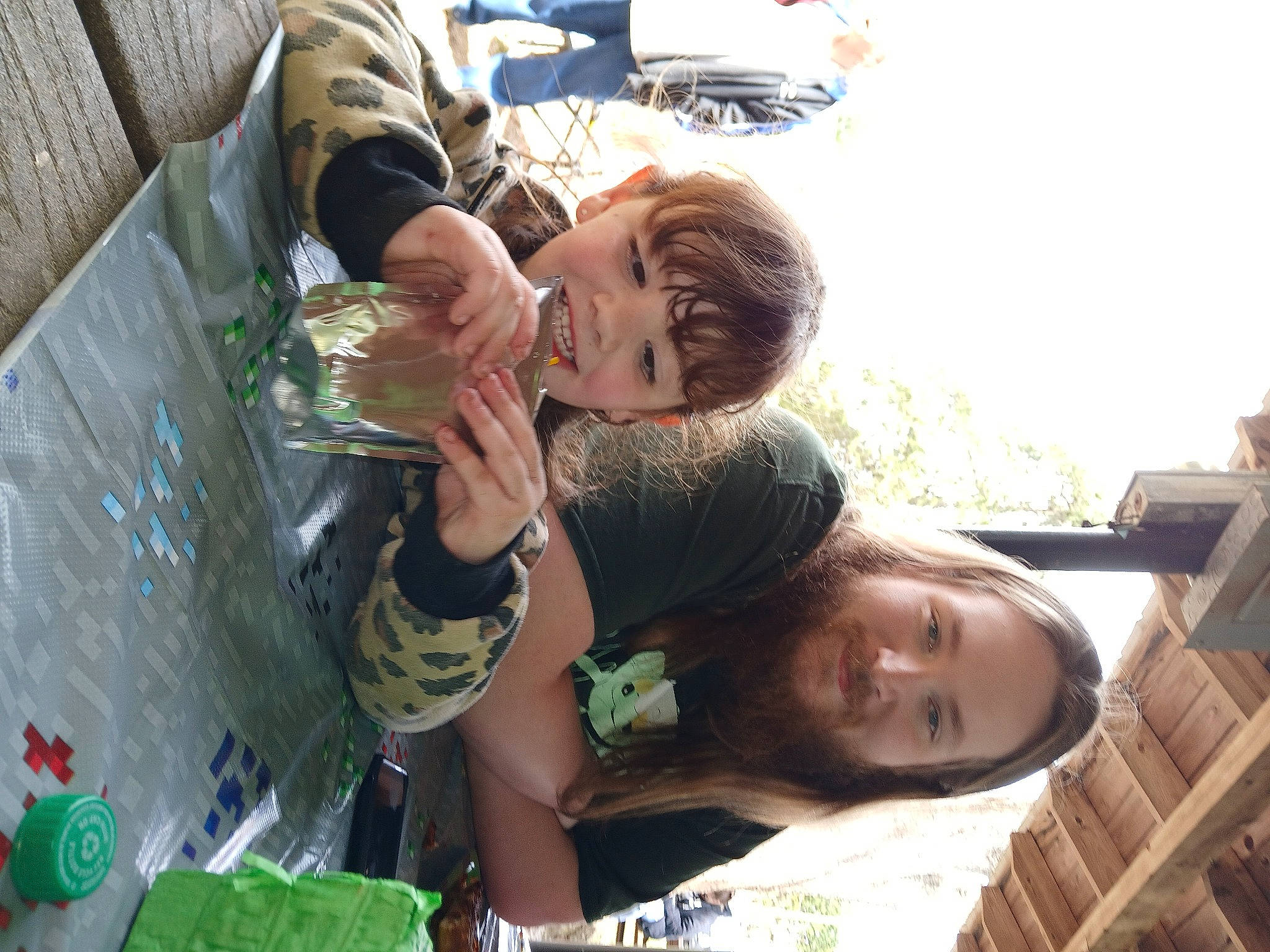 Taylor joined the competition — help win amazing prizes! child, event, fun, grass, green, happy, joy, leisure, person, plant, play, recreation, shorts, sitting, sky, smile, soil, t_shirt, toddler, tree