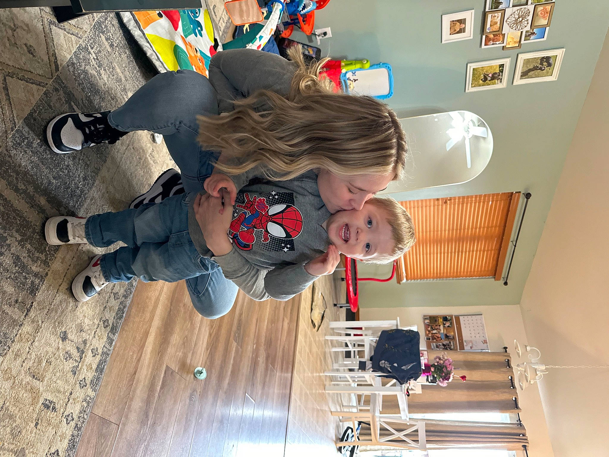 Jaxon is registered to the contest to win money with this photo: art, ceiling, child, fictional_character, flooring, fun, hardwood, leisure, machine, person, play, room, shelf, shelving, stairs, t_shirt, toddler, visual_arts, walking_shoe, wood